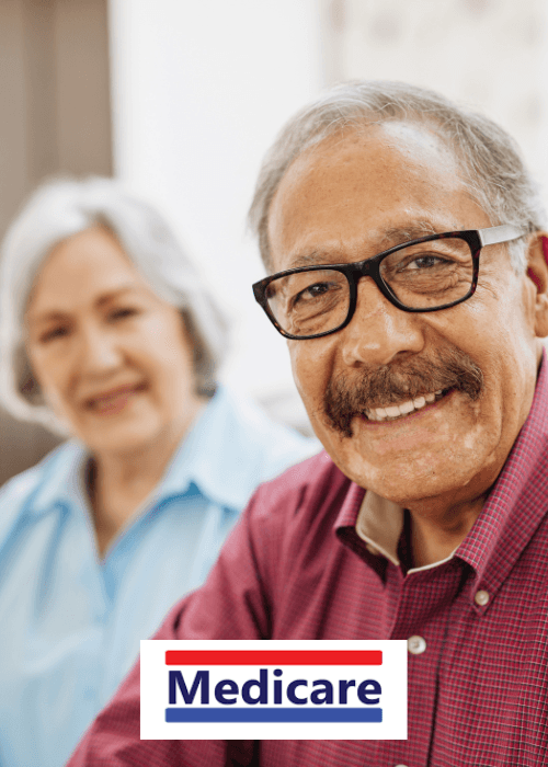 Smiling senior man with glasses and mustache, with a blurred woman and Medicare logo.